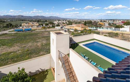 a view from the balcony of a house with a swimming pool at Beautiful Home In Cox in Cox