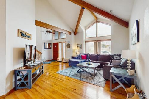 a living room with a couch and a table at Tall Trees Lodge in Eureka