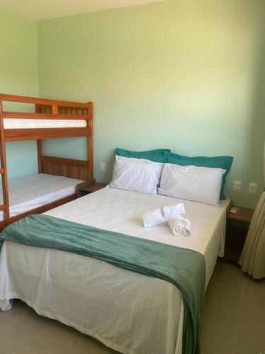 Postel nebo postele na pokoji v ubytování Condomínio Aliete Mendes