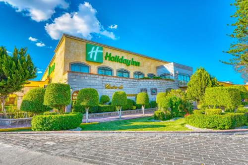 a hotel with a sign on the front of it at Holiday Inn Queretaro Centro Historico by IHG in Querétaro