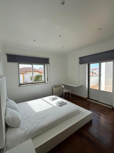 Ένα ή περισσότερα κρεβάτια σε δωμάτιο στο Ocean Guesthouse Baleal
