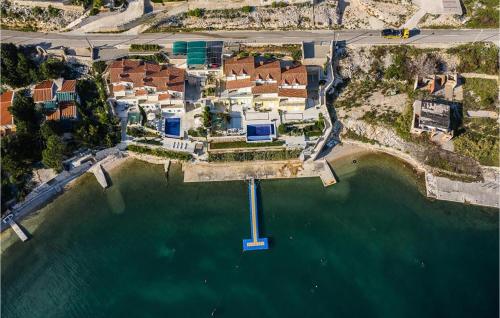an aerial view of a house on the water at Nice Apartment In Vidalici in Kustići
