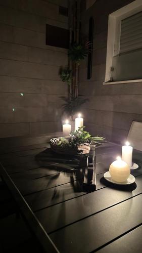 a table with candles on top of a table at Villa Giulia Rooms & Bike in Toscolano Maderno