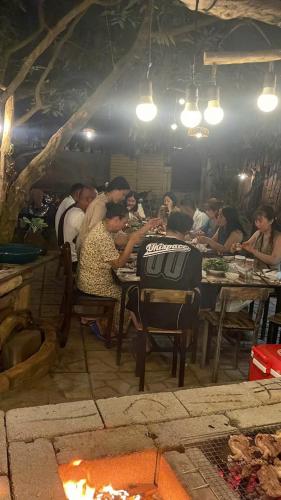 a group of people sitting at tables in a restaurant at BA DŨNG VILLA COFFEE - ĐẢO PHÚ QUÝ - Bình Thuận in Cu Lao Thu