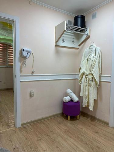 a corner of a room with aperatureperature at Уютный уголок in Shymkent