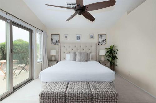 a bedroom with a bed and a ceiling fan at Monte Cristo Home - Epic Backyard Pool Spa & Firepit in Surprise