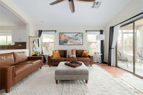 a living room with a couch and a table at Monte Cristo Home - Epic Backyard Pool Spa & Firepit in Surprise