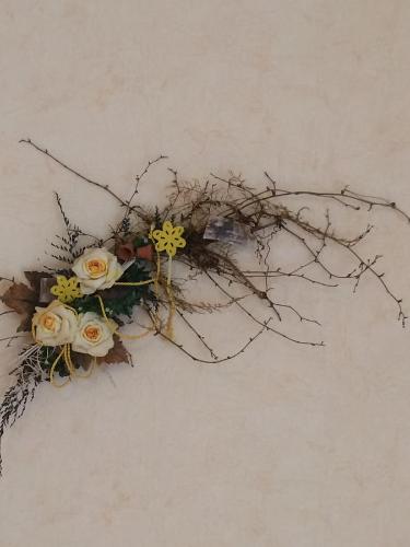 a bunch of branches and flowers on a wall at Pension Hönel-Hof Bad Schandau in Bad Schandau