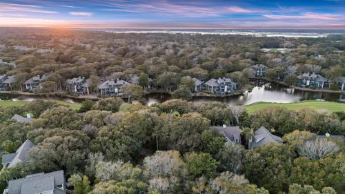 an aerial view of a subdivision of houses and a lake at SM05: 5 Silver Moss in Kiawah Island