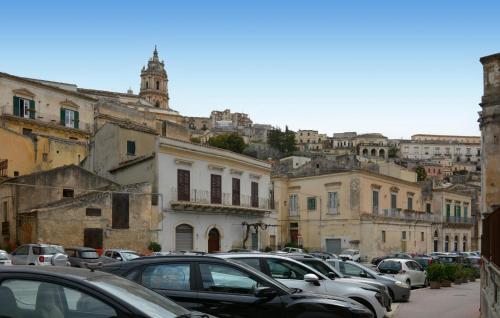 a bunch of cars parked in a parking lot at Pet Friendly Home In Modica With Wifi in Modica
