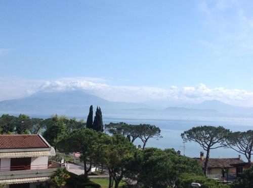 a view of the ocean from a house at Hotel Villa Rosa in Sirmione
