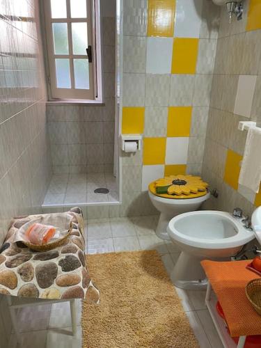 a bathroom with a shower and a toilet and a sink at Le Tre Ghinee in Tropea