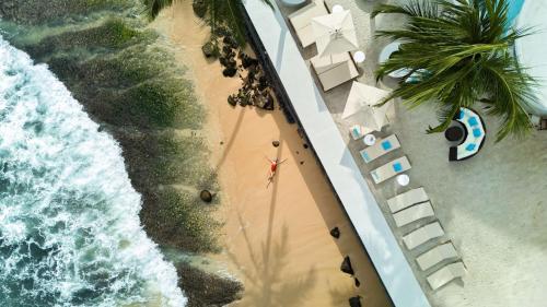 an overhead view of a beach with a person on it at Radisson Collection Resort Galle in Galle