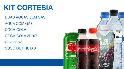 three bottles of coca cola and a can of soda at Hotel Gran Vivenzo Belo Horizonte in Belo Horizonte