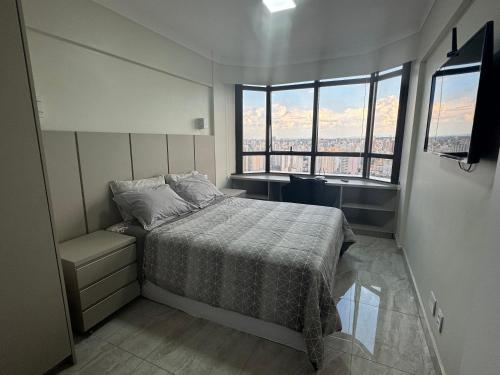 Ένα ή περισσότερα κρεβάτια σε δωμάτιο στο Flat Mobiliado em Campinas - Ap 202