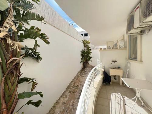 a balcony with plants on the side of a building at Le Terrazze in Otranto