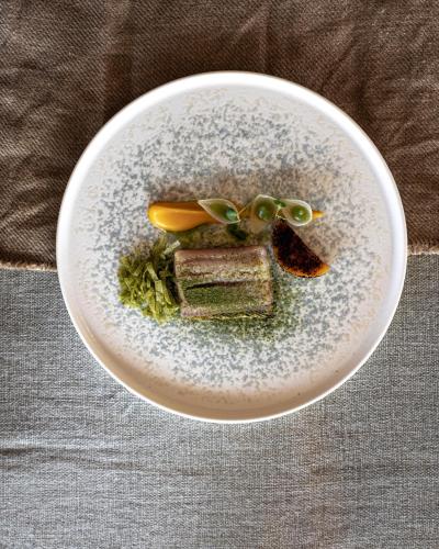 a plate of food with glasses on top of it at Les Palétuviers in Toubakouta