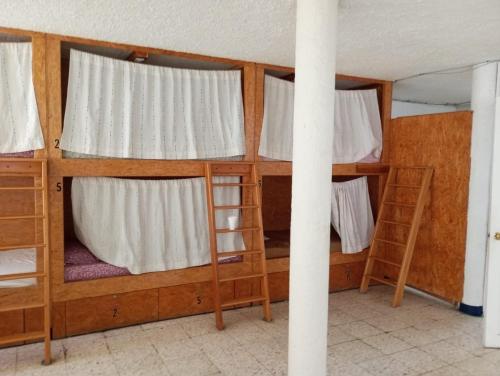 Postel nebo postele na pokoji v ubytování Hotel China Poblana