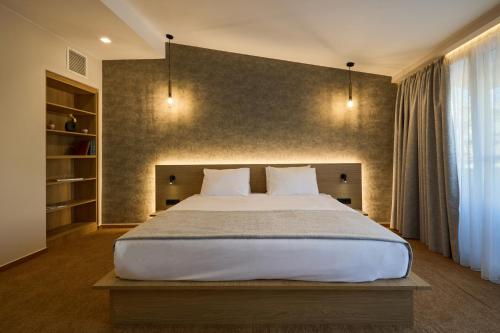 Katil atau katil-katil dalam bilik di Athens City Suites