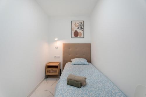 Ένα ή περισσότερα κρεβάτια σε δωμάτιο στο Granada Park S01B