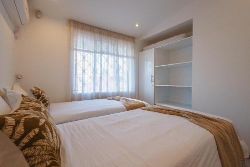 Un ou plusieurs lits dans un hébergement de l'établissement Coco Beach I&II - 6 Bedrooms , Private Pool , Beach at 200 meters