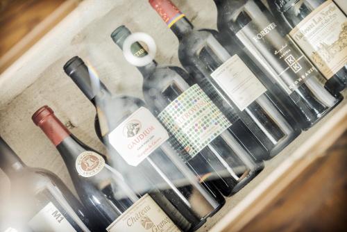 a bunch of bottles of wine in a drawer at Almhof Roswitha in Hippach