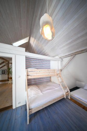 a bunk bed in a room with a light at Renesanční dům in Mikulov