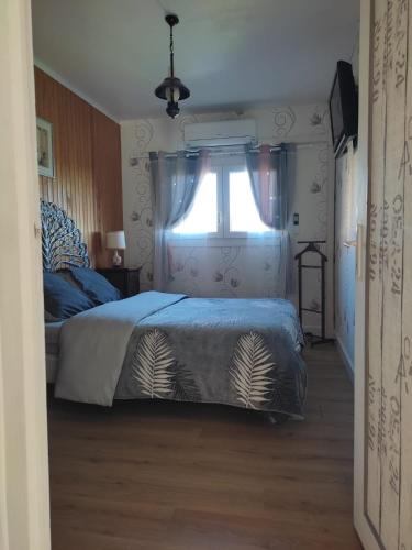 Ένα ή περισσότερα κρεβάτια σε δωμάτιο στο Le Chalet des Masnils