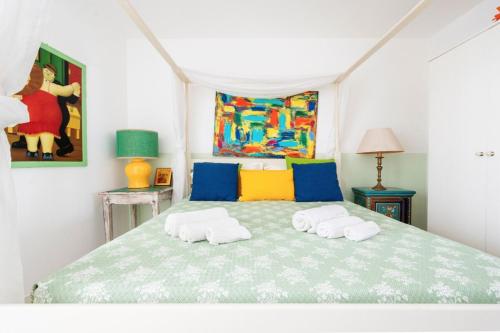 a bedroom with a large bed with two towels at Le Terrazze in Otranto