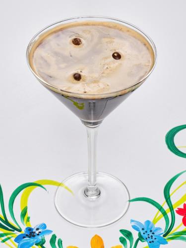 a martini glass filled with a white drink at Resort EuroPark Fundata in Fundata
