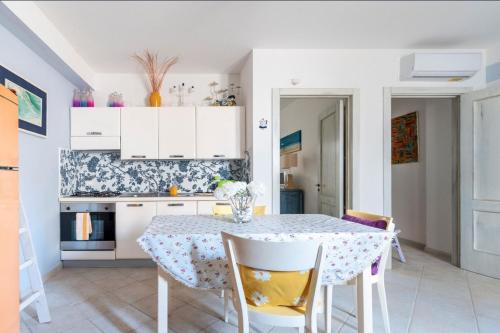 a kitchen with a table and chairs in a room at Le Terrazze in Otranto