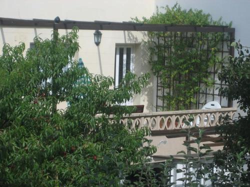 a balcony of a house with trees in the foreground at Tranquilidad cerca de playas y lugares históricos VUT-LU-00402 in Lourenzá