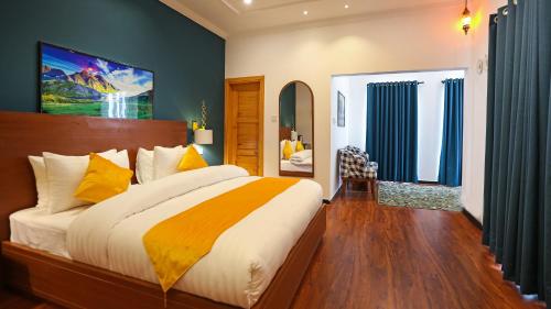 a bedroom with a large bed in a room at Destination Resort Thandiani in Abbottabad