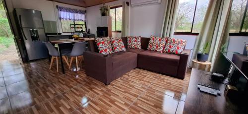 a living room with a couch and a table at House of Dreams in Nicoya