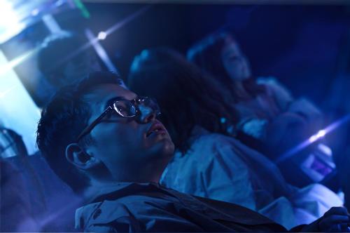 a man with sunglasses sitting on a bed with a woman at Telos Discovery Space Center in Orem