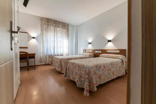 Postel nebo postele na pokoji v ubytování Hotel Pedro Torres