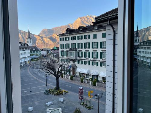 a view from a window of a street and buildings at Neptun 5 - Zimmer mit Kochgelegenheit im Zentrum in Bad Ragaz