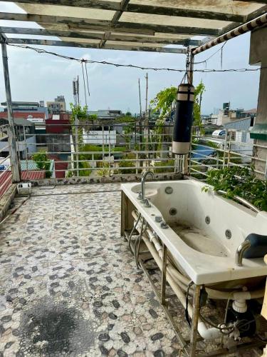 a bath tub sitting on top of a building at HnHome89TL in Hanoi