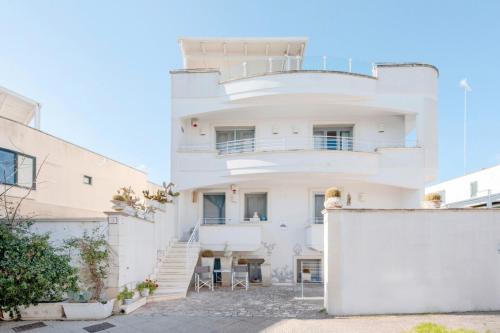 a white house with stairs up to it at Le Terrazze in Otranto
