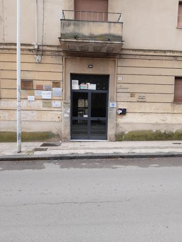a building with a door on the side of a street at G&D Suite Apartment in Caltanissetta