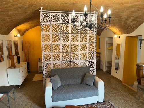 a living room with a couch and a wall at Ambra in Viverone
