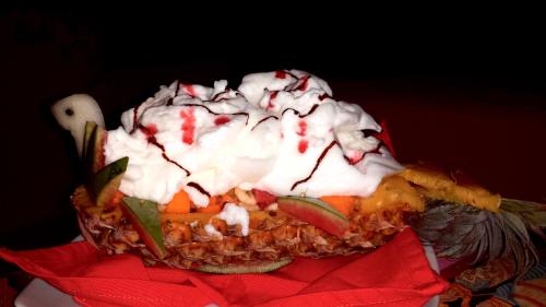 a dessert with whipped cream on top of it at Shangri-Lanka Village in Tissamaharama