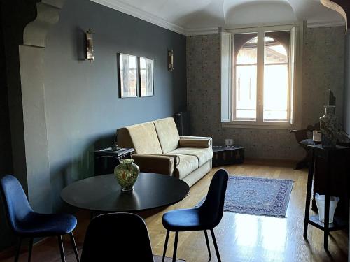 a living room with a couch and a table at N°30 CHARME Apartments in Vigevano