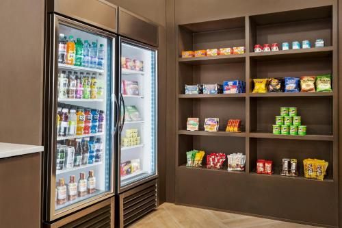 a refrigerator filled with lots of food and drinks at Staybridge Suites College Station by IHG in College Station