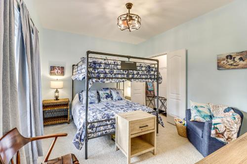 a bedroom with a bed and a desk and a chair at Walk to Bay Home with Fenced Yard in Colonial Beach in Colonial Beach