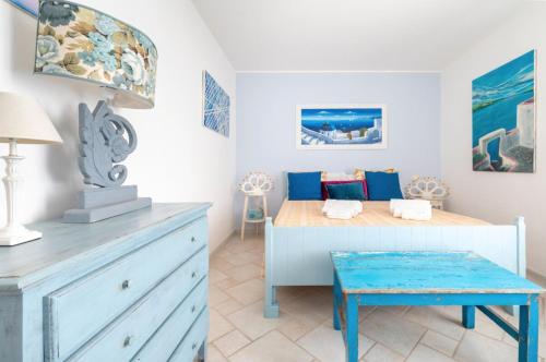 a bedroom with a bed and a dresser at Le Terrazze in Otranto