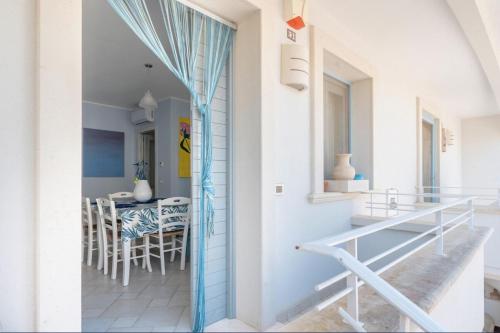 a room with a balcony with a table and chairs at Le Terrazze in Otranto