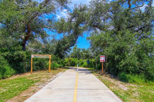 a bike path with a sign on the side of it at Myrtle in Rockport