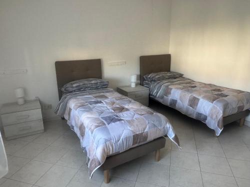 Una cama o camas en una habitación de Cammeo Home