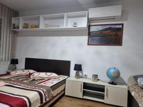 Postel nebo postele na pokoji v ubytování Apartment Ada Kaleh